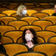Customers wearing protective masks sit apart in observance of social distancing measures inside a movie theater as the Czech government lifted more restrictions allowing cinemas to re-open on May 11, 2020, in Prague, Czech Republic.